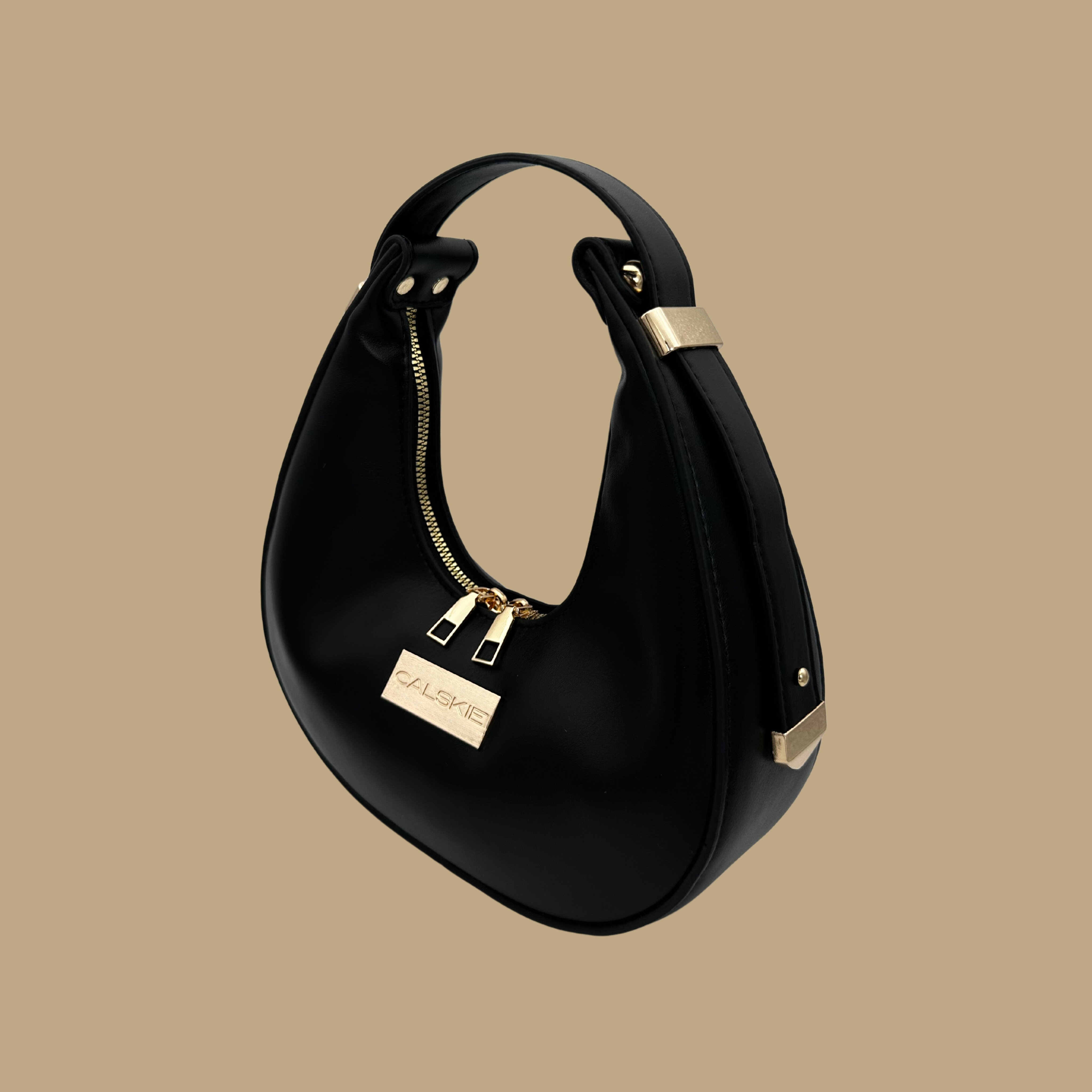 Black Vegan Leather Top Handle Bag, a blend of elegance and practicality designed to evoke feelings of empowerment and grace.